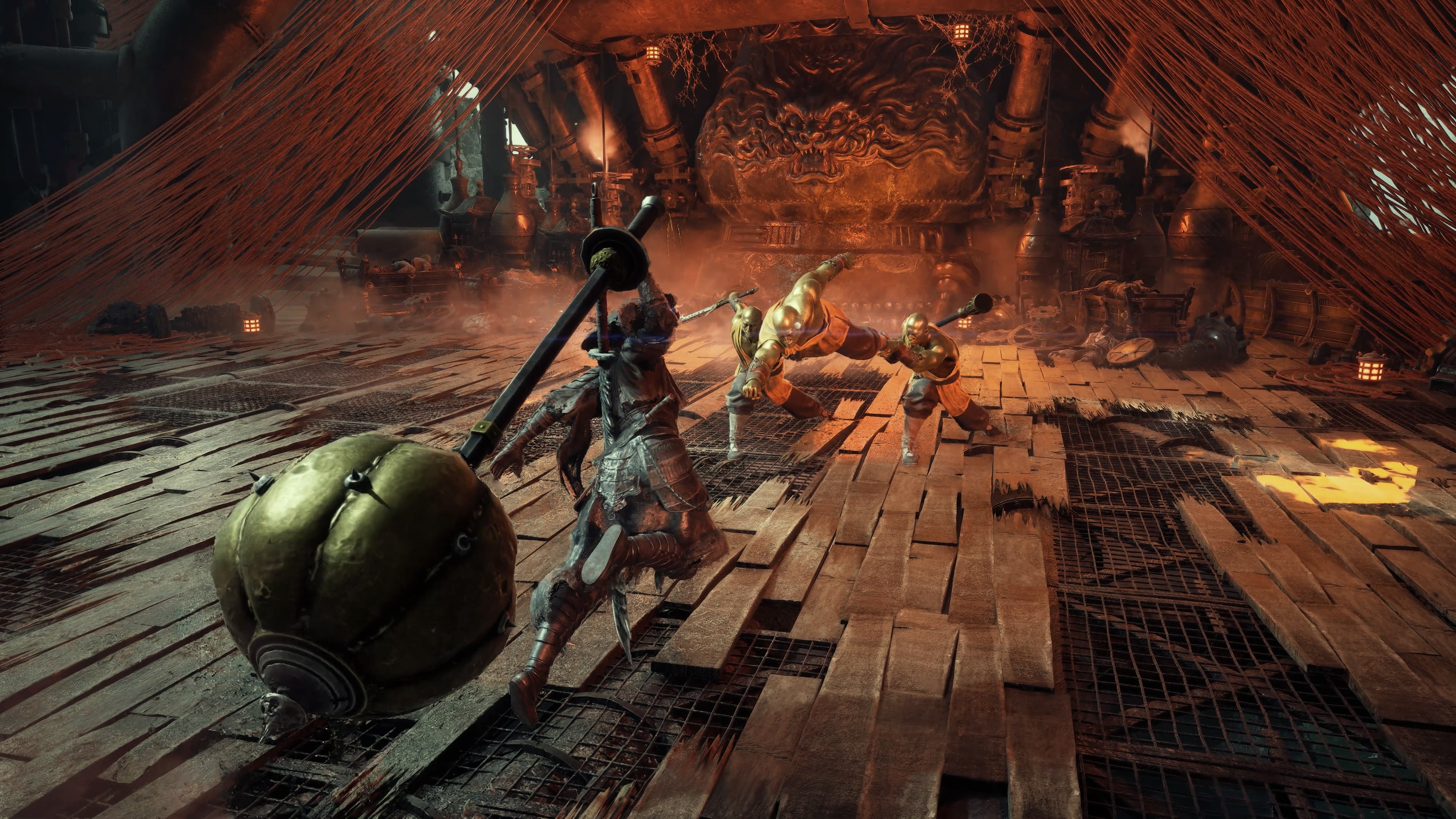 Three figures facing each other on a forge-lit boss arena floor under hanging red threads and a bronze mask relief.